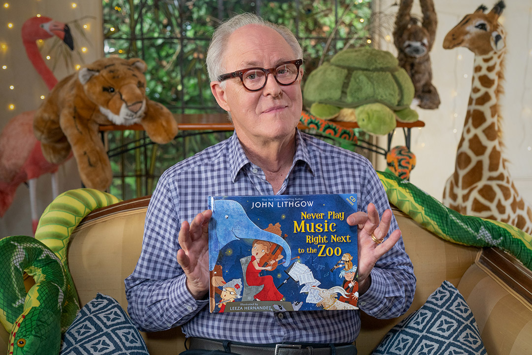 Actor John Lithgow with his book, Never Play Music Right Next to the Zoo.