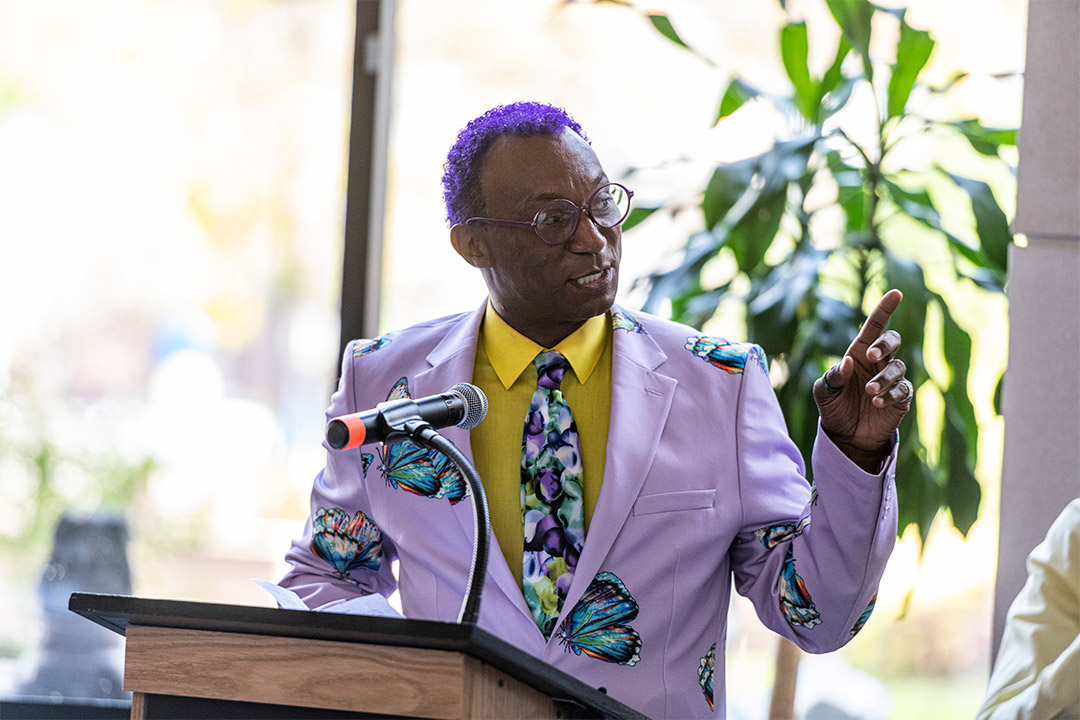 man speaking at podium.