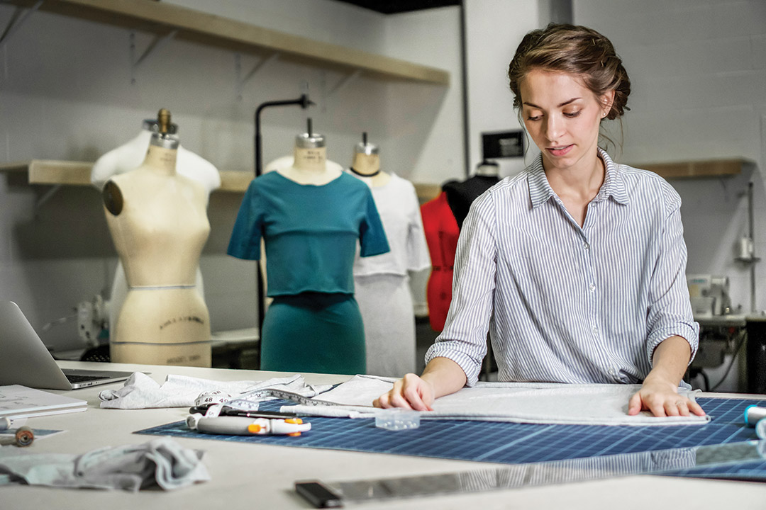 student working on a dress pattern.