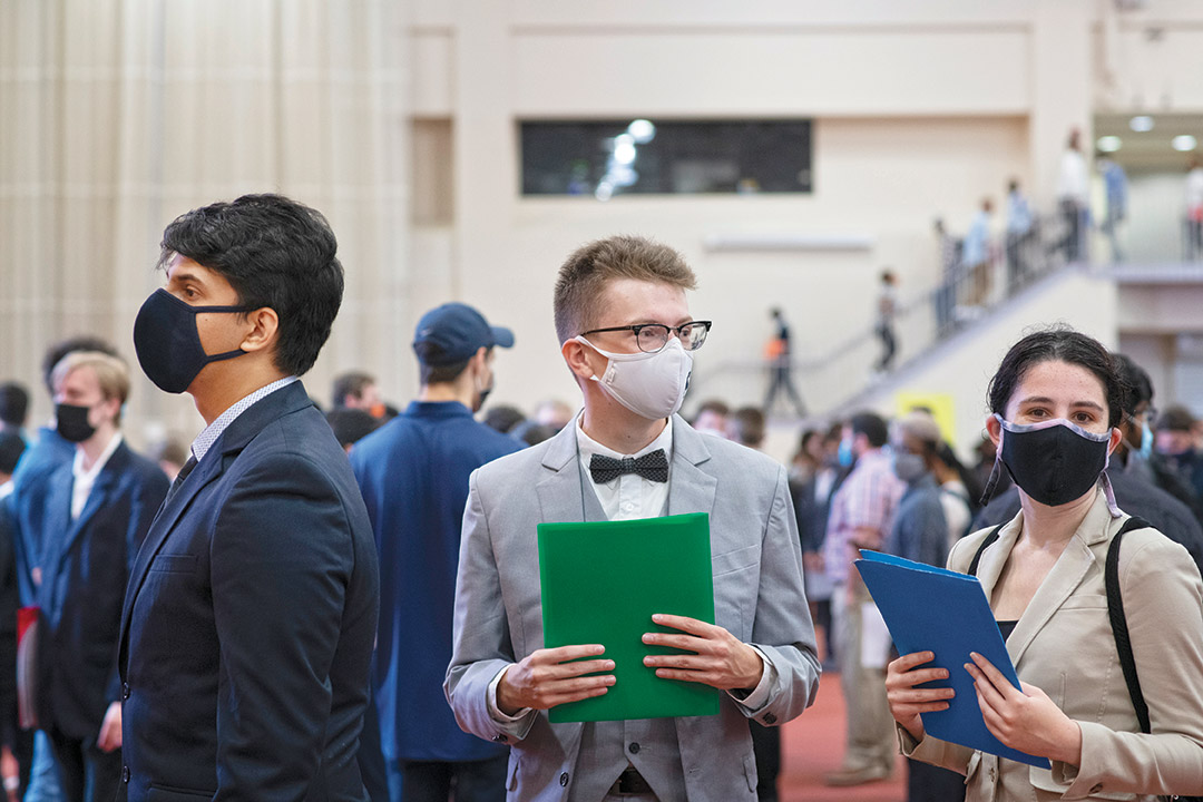 students waiting in line at a career fair.