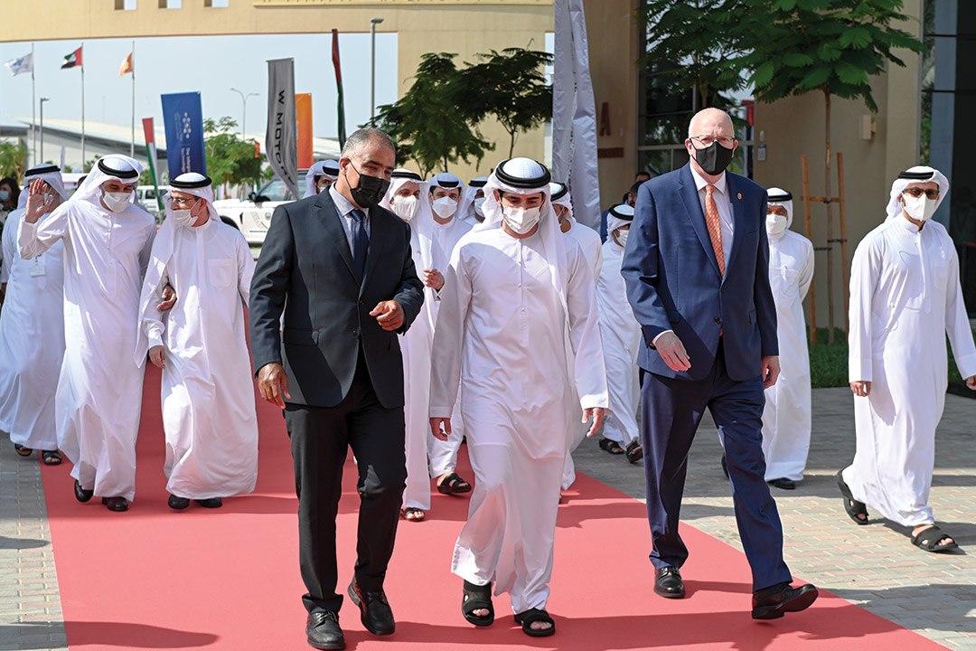 group of men walking on the campus of RIT Dubai.