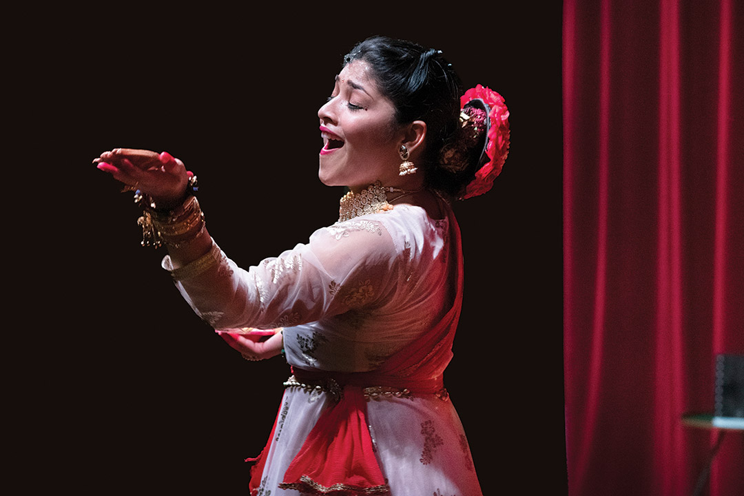 student performing traditional Indian dance.