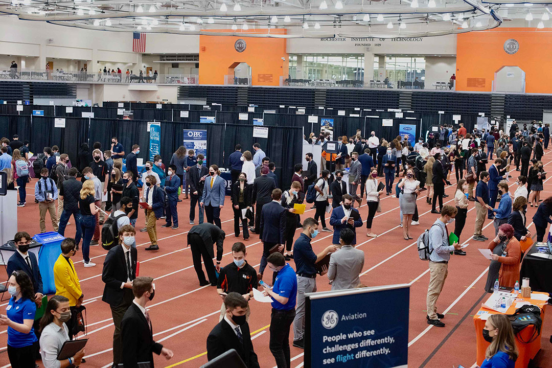 Students attending career fair booths.