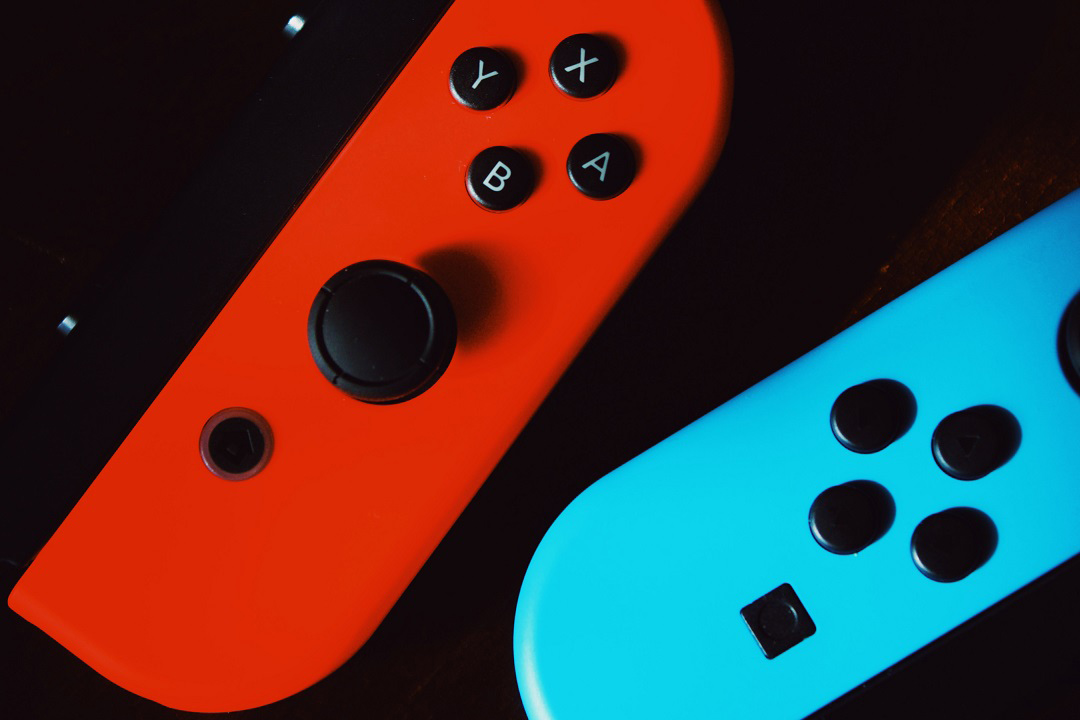 red and blue controllers from a Nintendo Switch.
