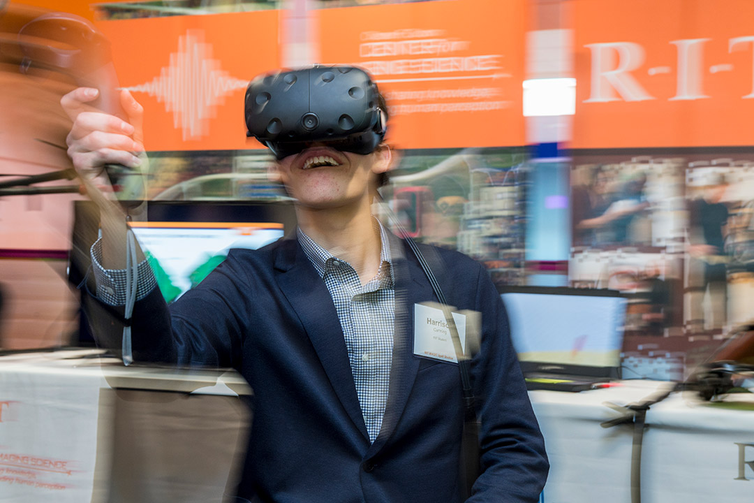 person using a virtual reality headset and wand.