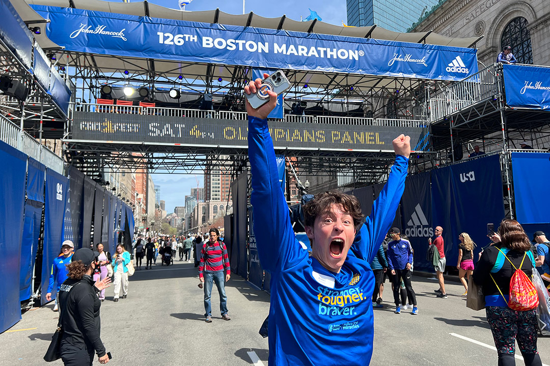 student running through the finish line of the Boston Marathon.