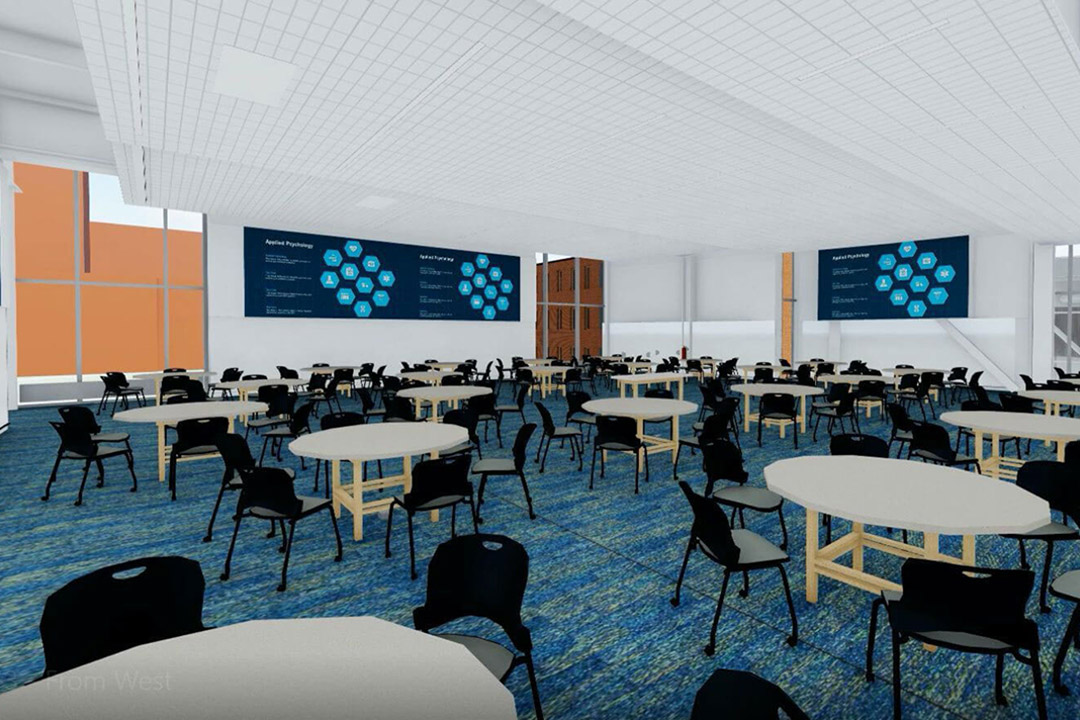 artists rendering of a large classroom space with several smaller round tables and chairs.