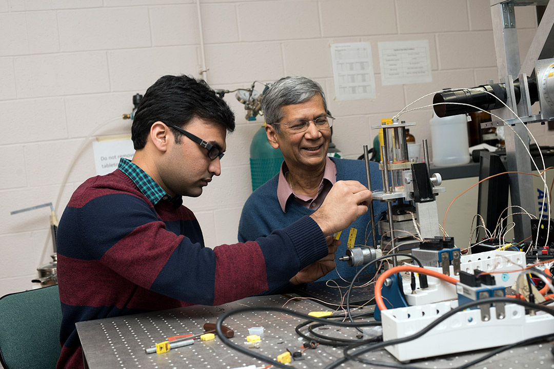 professor and student working with imaging equipment.