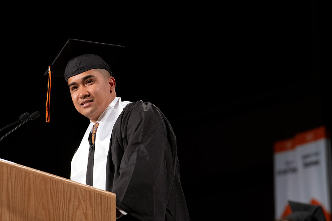 student government president speaking at a podium.