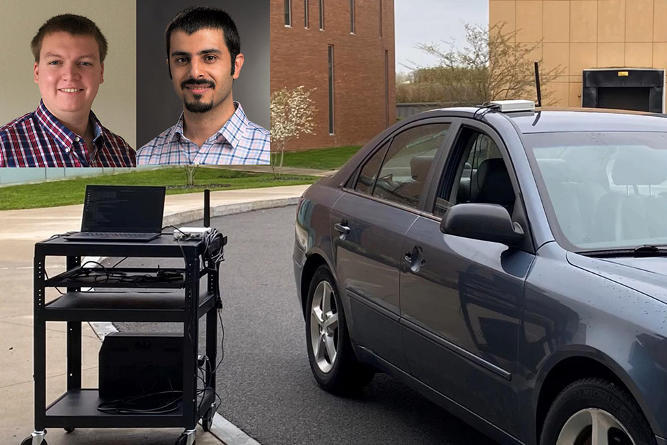 A navy blue car parked next to a cart with a laptop on it. Portraits of two researchers in the upper left corner