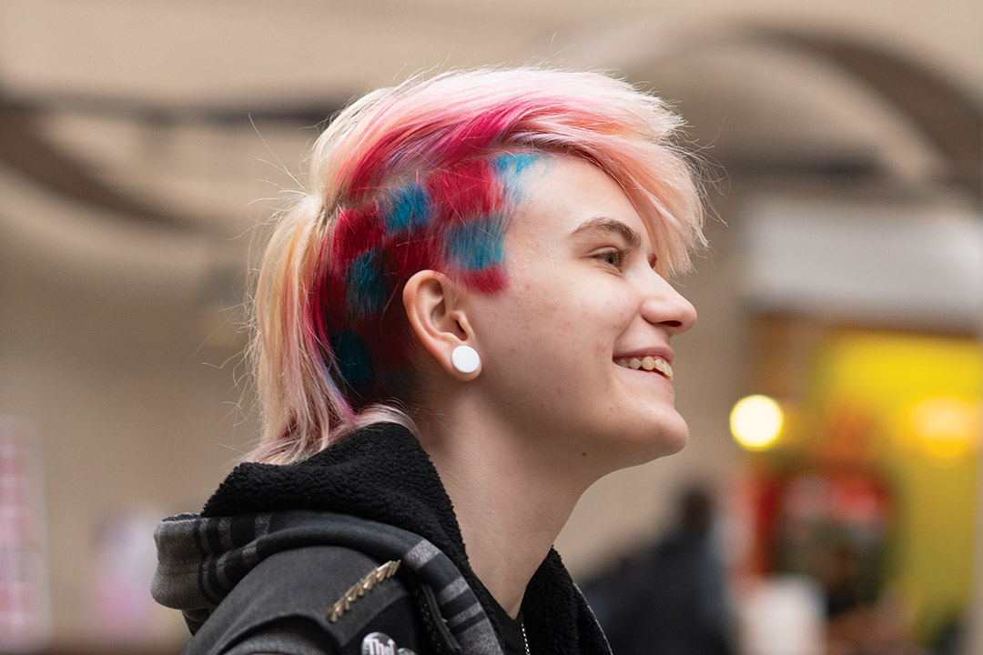 student with blond, red, and blue hair.