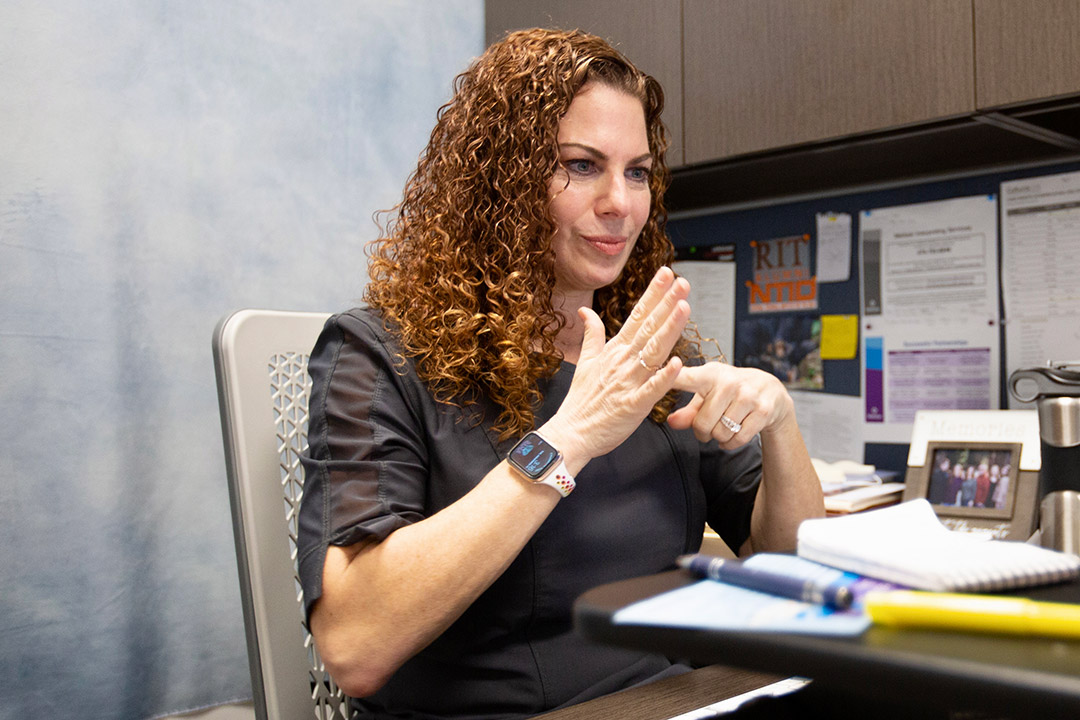 woman communicating with American Sign Language.