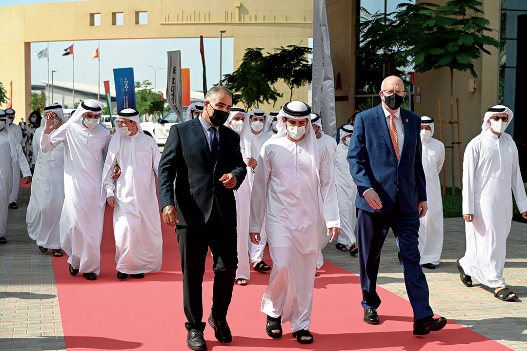 group of men walking on the campus of RIT Dubai.