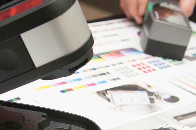 magnifiers on a paper with different color blocks.