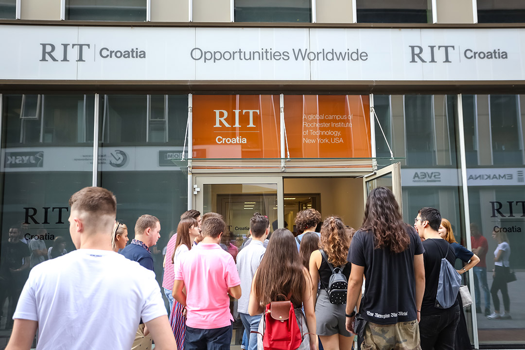 group of students walking into a building at RIT Croatia.