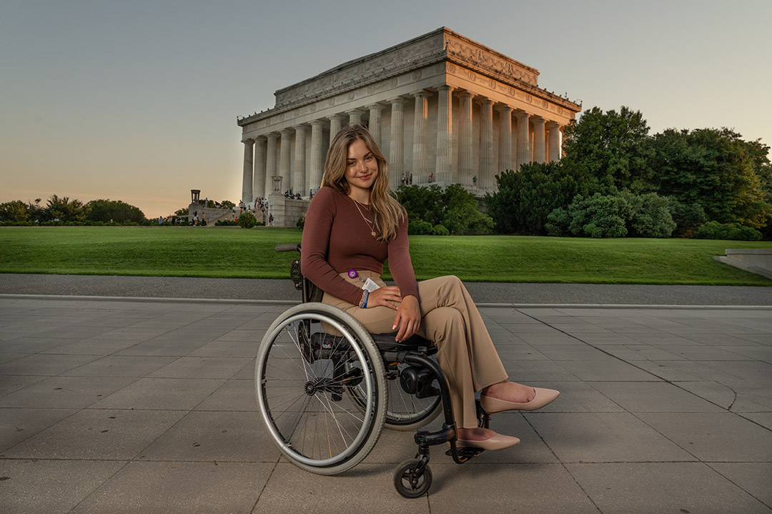 student in a wheelchair in front of the Lincoln Memorial.