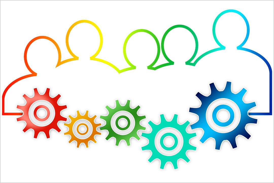 graphic showing the outline of five people and five gears in rainbow colors.