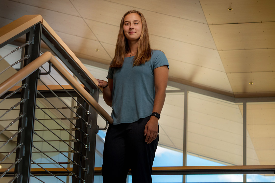 student standing at the top of a stairwell.