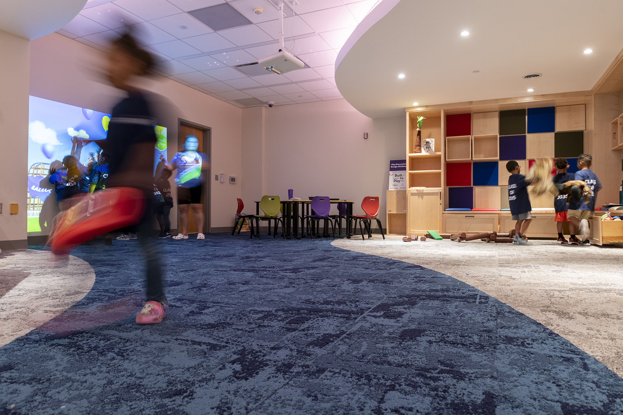 Youngsters play in the Secret Room at the Rochester library.