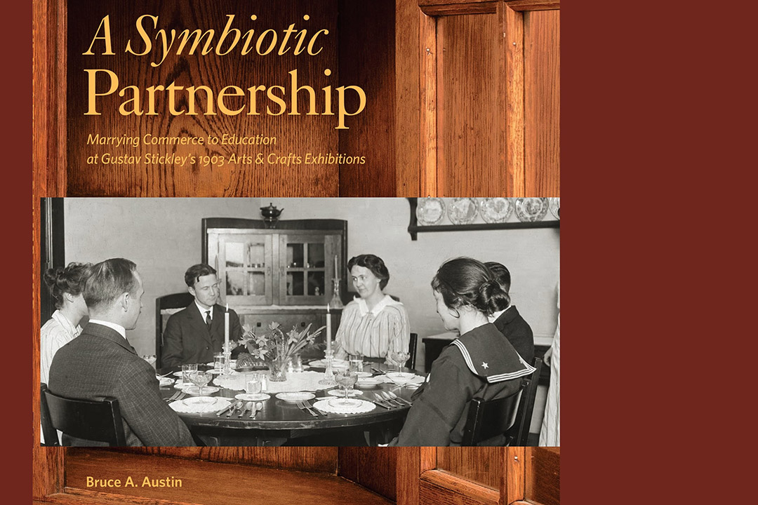 book cover with six people seated at a dining room table with the title, A Symbiotic Partnership.