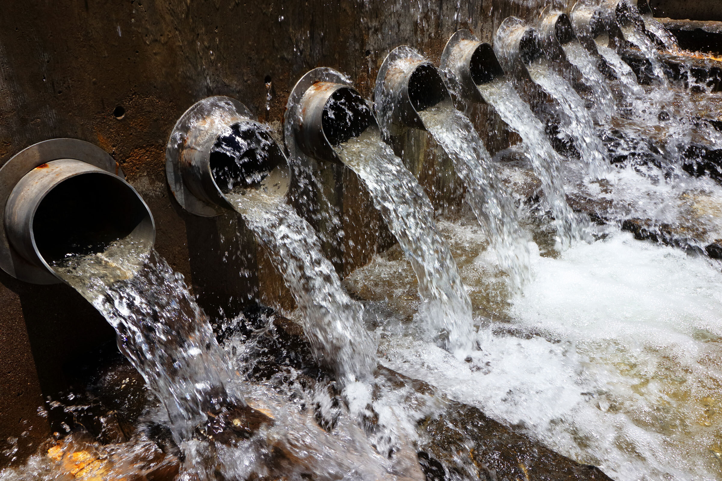 Water flows through pipes in a municipal waste-treatment facility.