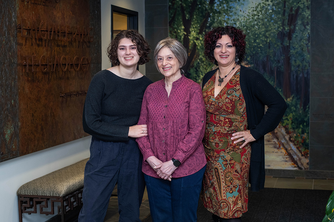 three generations of women posing for a photo.