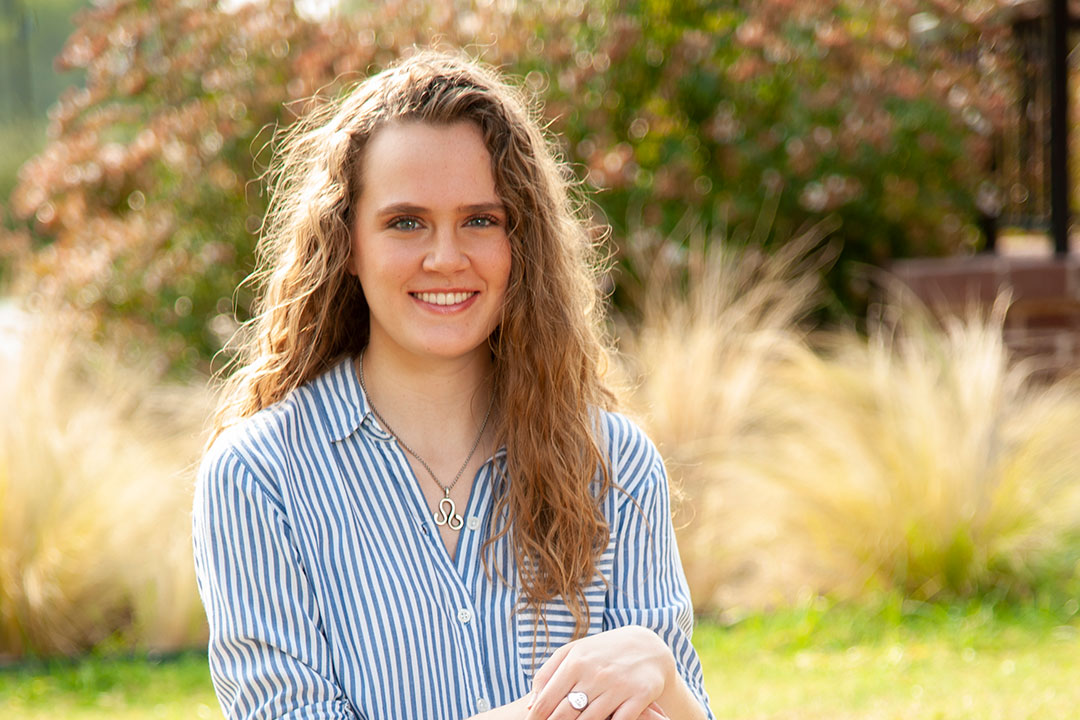 Photo of Julia O'Gorman sitting in a field