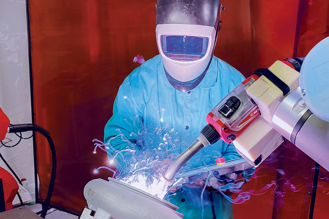 a person using next-generation welding equipment.