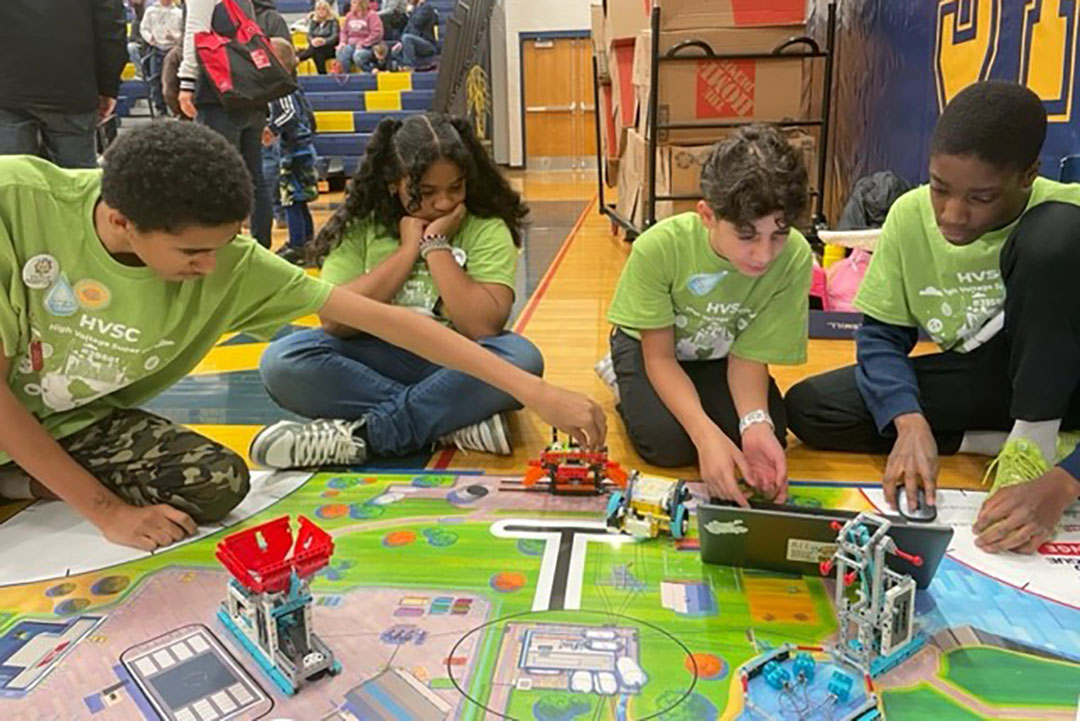 Middle school students in the STEP's robotics program participates in event at Spencerport High School gymnasium using robotics and computers