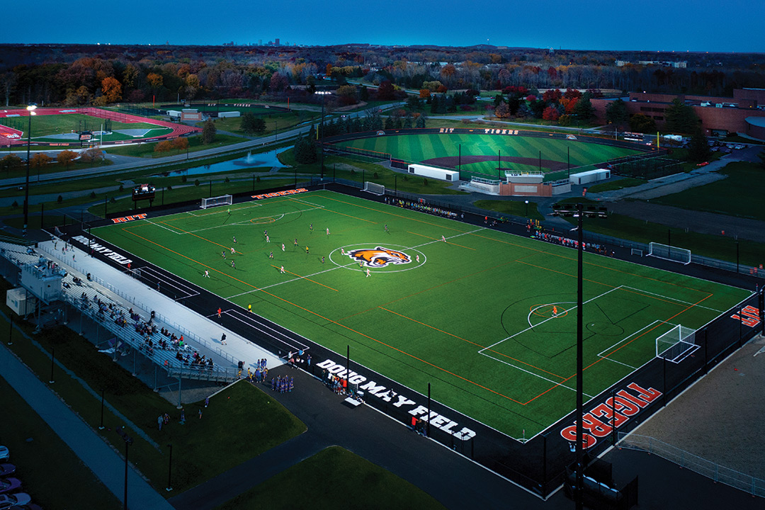 aerial view of a soccer field, baseball diamond and track and field complex.