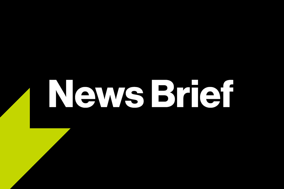 A graphic with a black background, a green ribbon graphic, and bold white text that reads, "News Brief". 