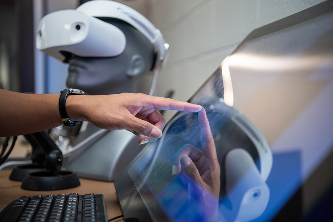 Person using a touch screen computer.