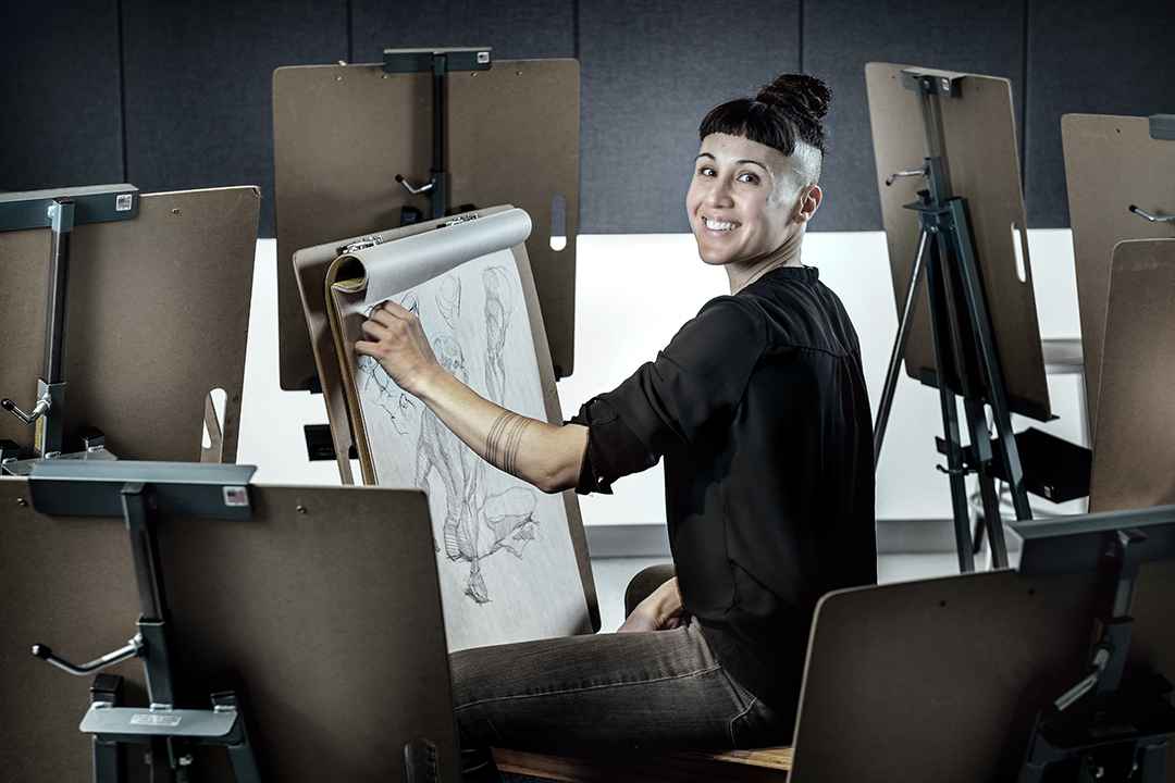 Person drawing on an easel