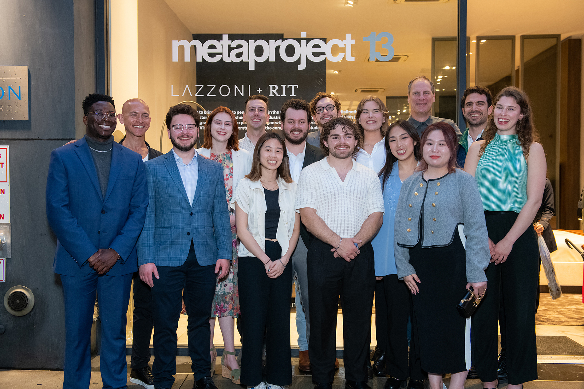 Students, faculty and alumni of Metaproject 13 pose in front of Lazzoni's showroom in NYC.