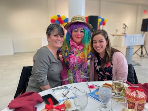 a photo of the interim dean with a clown and jennifer