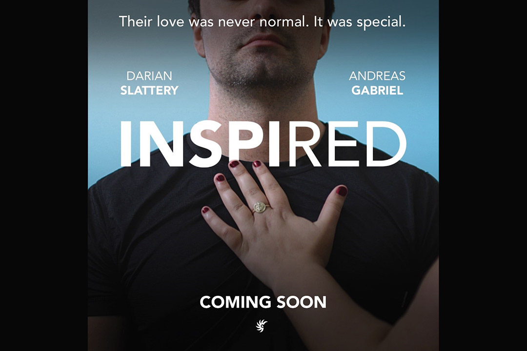 poster for the movie Inspired, with a man wearing a black tee shirt standing against a blue background and a woman’s hand resting on his chest.