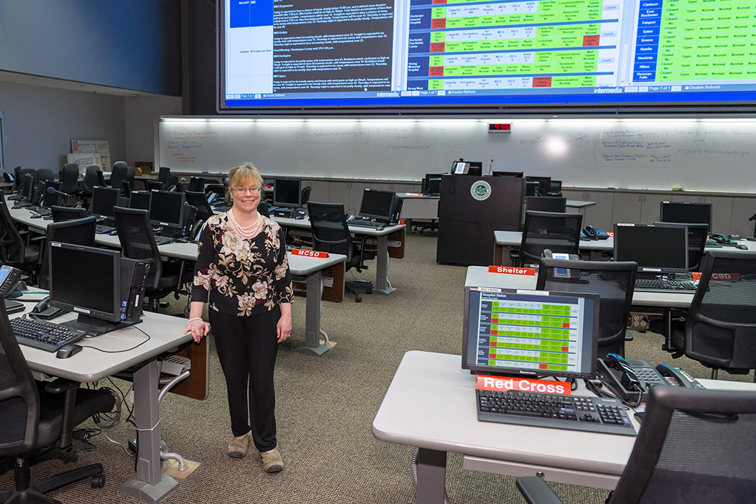 faculty member standing in a computer lab.