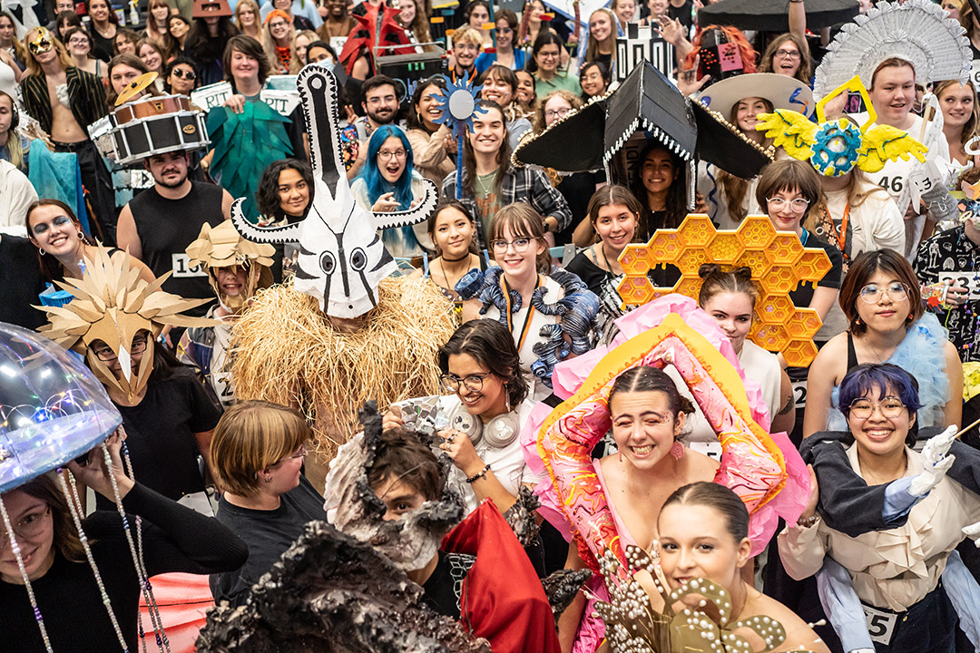 group of college students wearing pieces of art that fit the theme of rhythm.