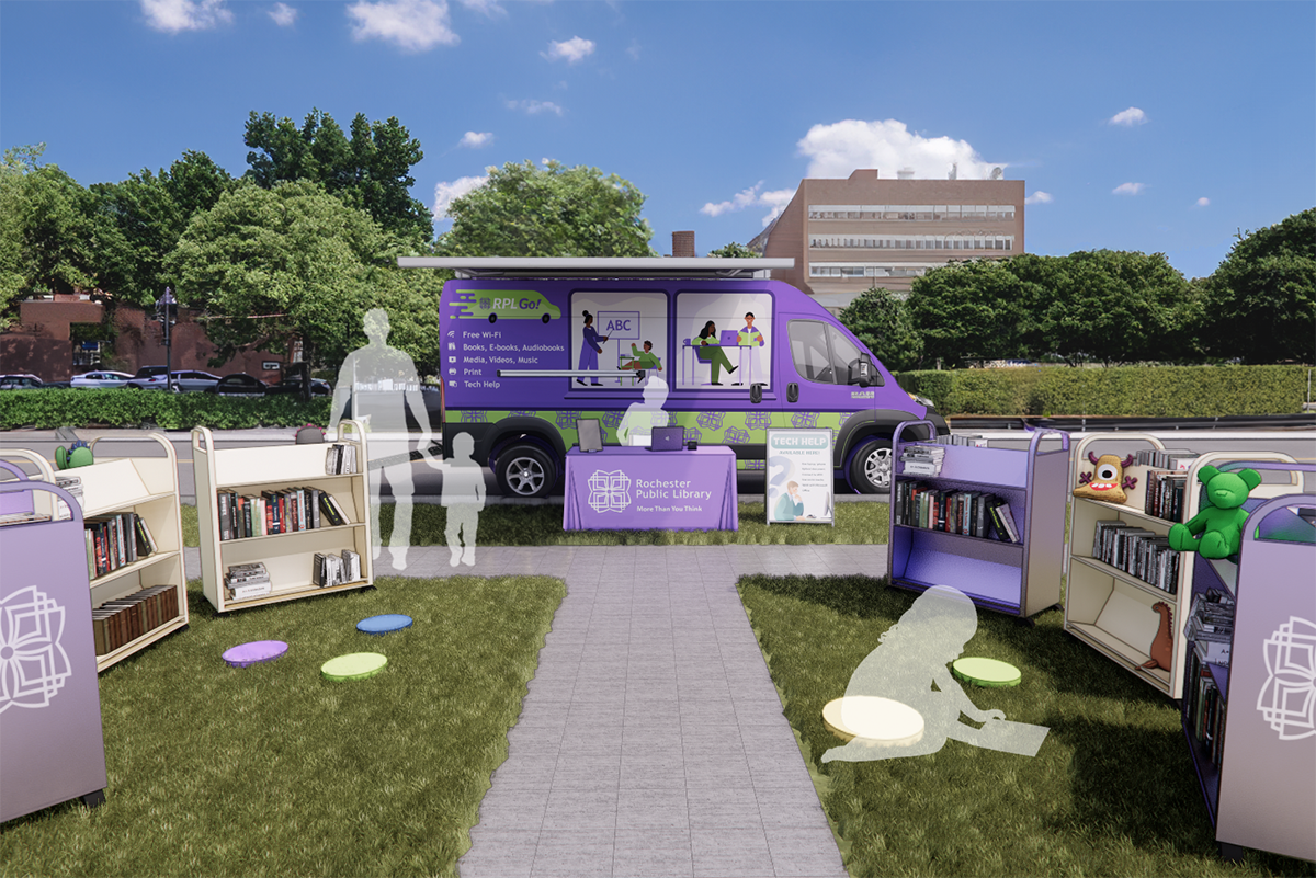 A mobile library setup with a bookmobile, carts and tables set up to accommodate walk-up traffic.
