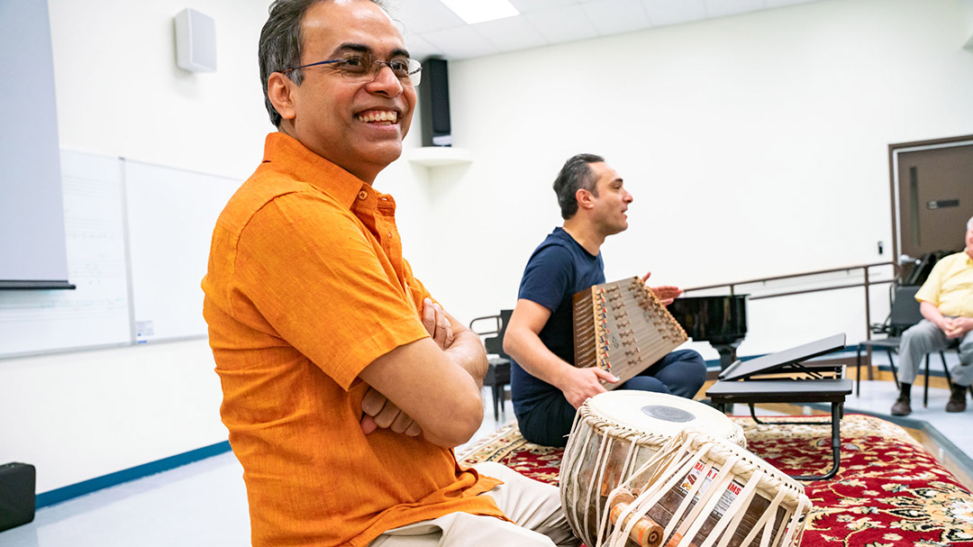 Indian Tabla player Sandeep Das is shown leading a master class with RIT student musicians