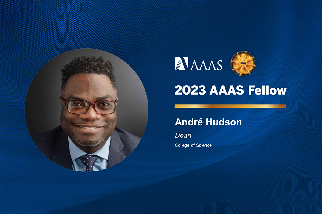 a headshot of Andre Hudson appears in a circle to the left on a blue background. To the right appears the AAAS logo and the words Associate Fellow with Andres name and title.