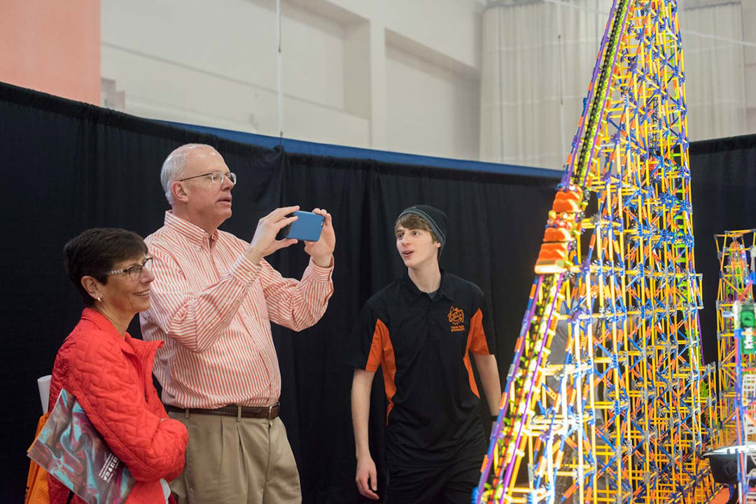 RIT President David Munson and his wife, Nancy, check out the RIT Theme Park Enthusiasts exhibit at an earlier festival. 