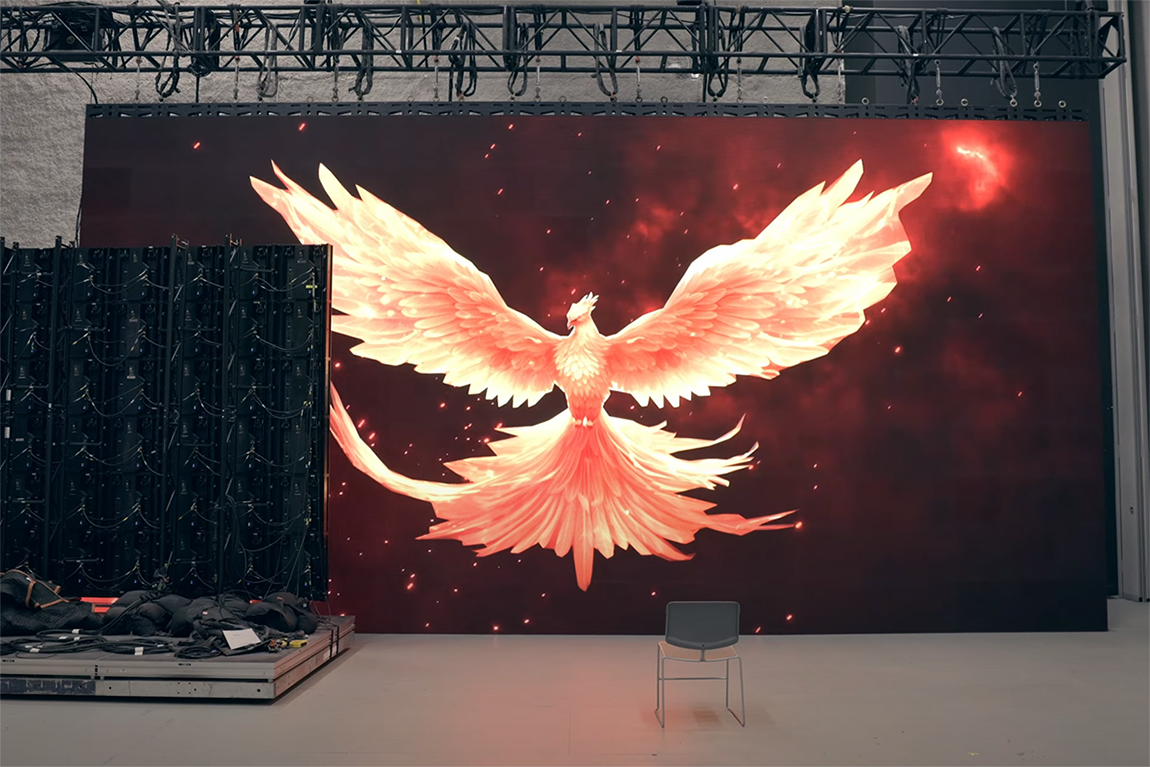 An AR phoenix emerged on a large LED wall. 
