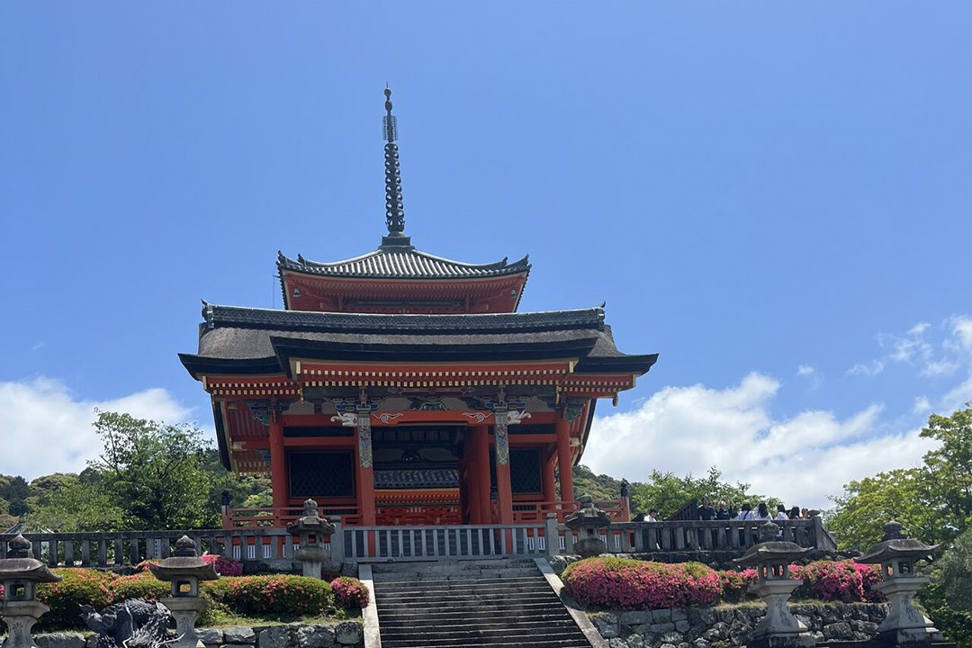 'The Kiyomizudera Temple in Japan is shown against a blue sky.'