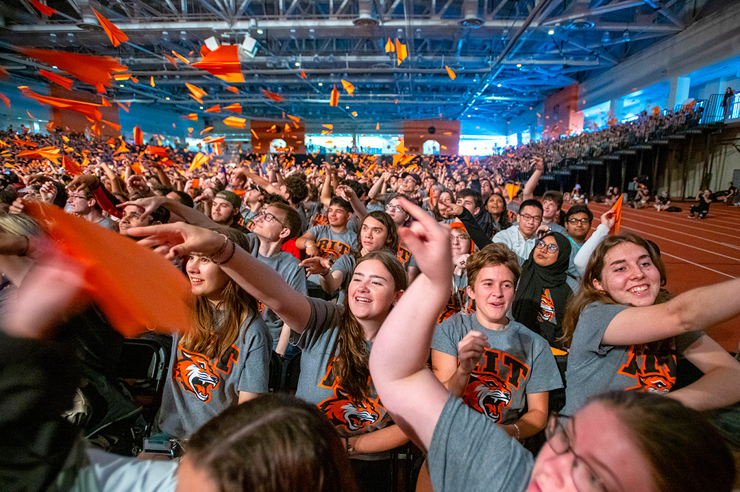 Students throw paper planes with their dreams to end the Fall Convocation for New Students 