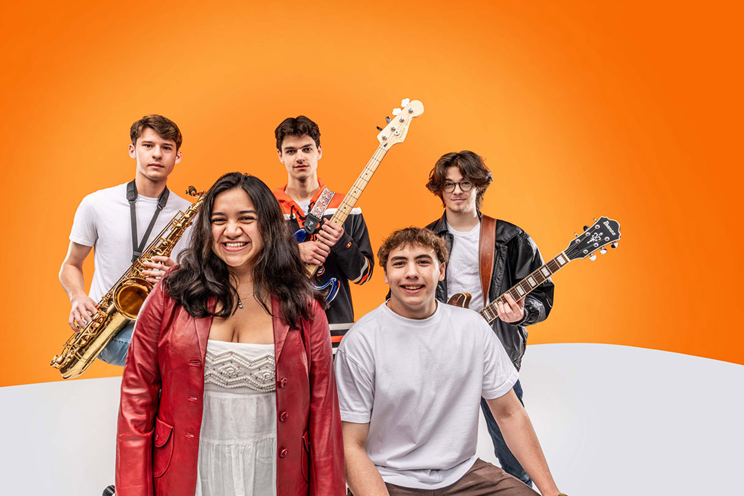 Five Courtyard members are shown in a group photo holding instruments in front of an orange background.