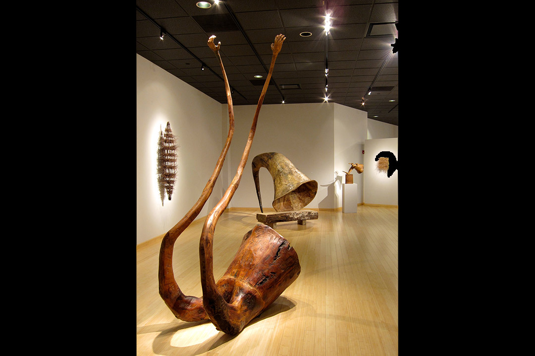 Rear view of one of Wolff's pieces, which features a horn like shape separating into two tentacle like arms.