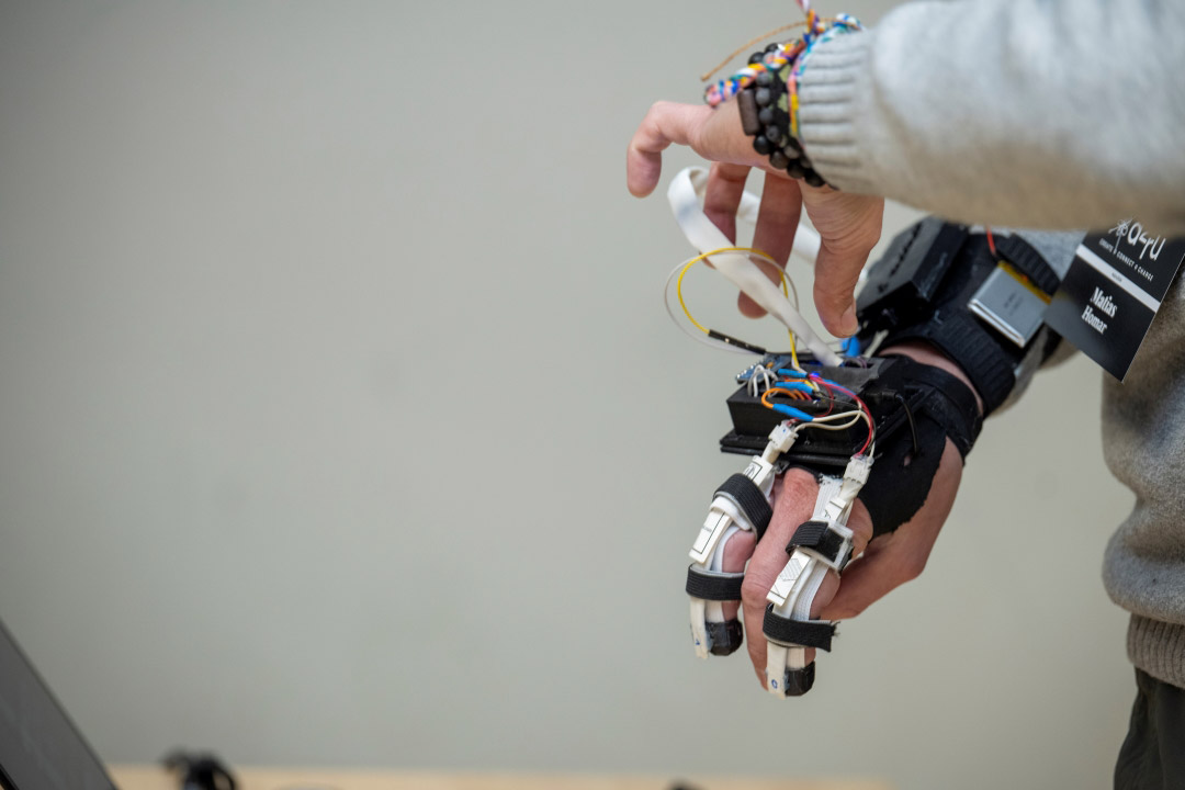 a hand with robotic elements attached is shown.