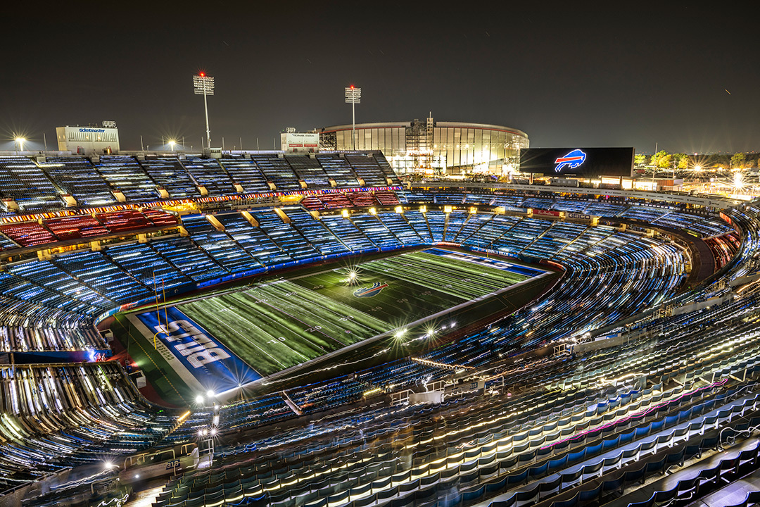 Buffalo Bills Highmark Stadium is shown lighted in an arial view.
