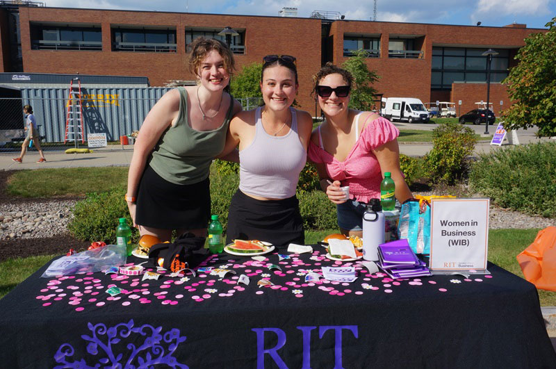 Women in Business students smiling at fall picnic.